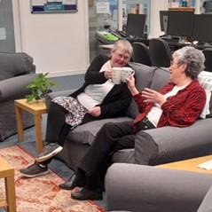PIC - EVENTS - Welcome space 2 women sitting on sofa having a cuppa